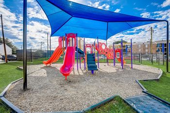 Outdoor playground area with sunshade